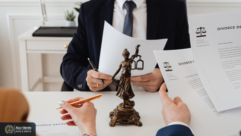 Attorney and client reviewing legal documents across a desk during a consultation